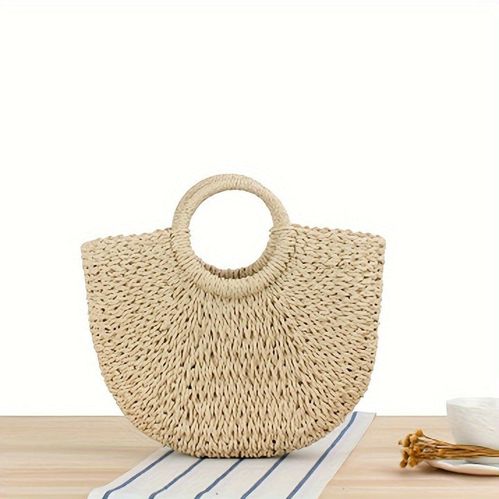 Ottavia – Halbmond-Tasche aus geflochtenem Stroh – Naturbeige