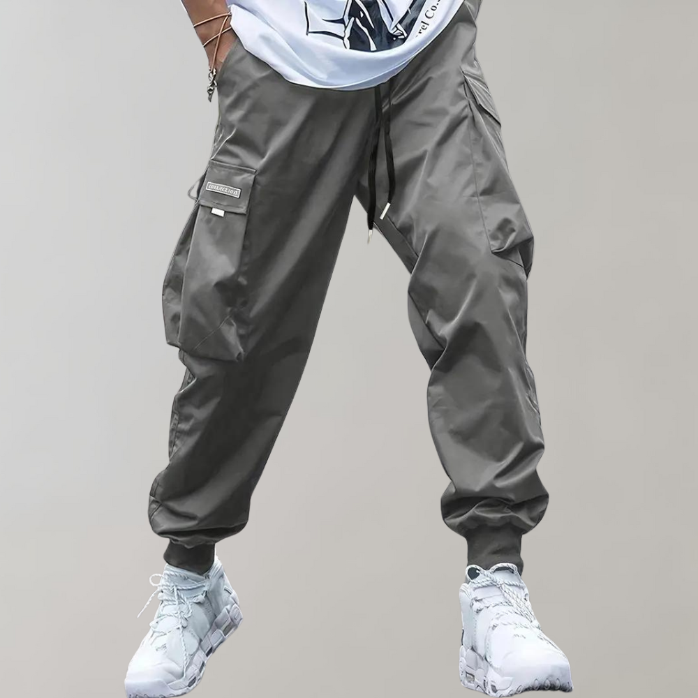 Nael Berlin | Herren Cargo Jogginghose – Lila Streetwear-Hose mit Reißverschlusstaschen & Bündchen