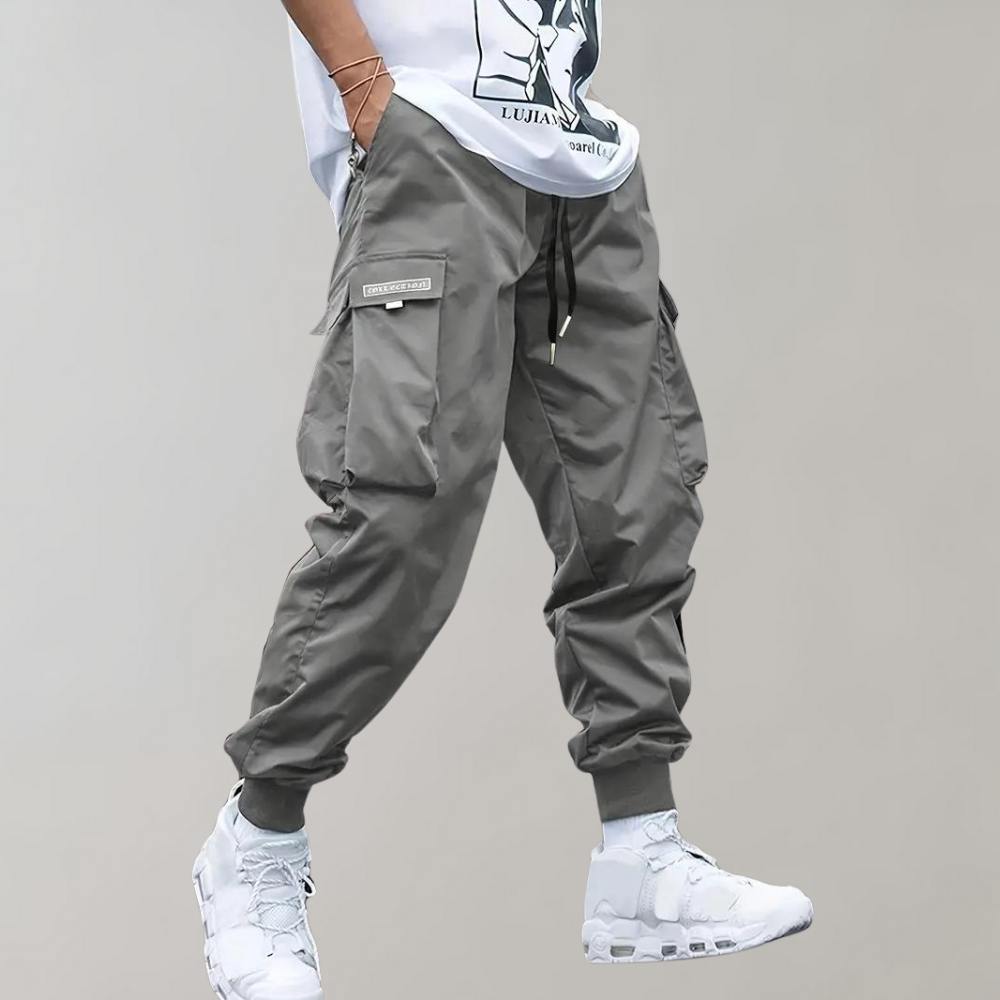Nael Berlin | Herren Cargo Jogginghose – Lila Streetwear-Hose mit Reißverschlusstaschen & Bündchen