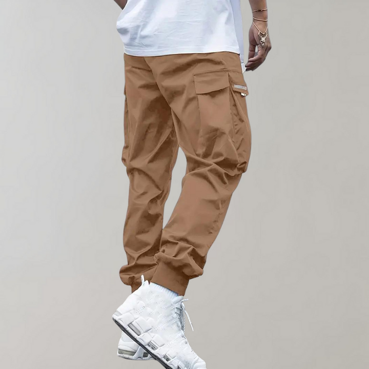 Nael Berlin | Herren Cargo Jogginghose – Lila Streetwear-Hose mit Reißverschlusstaschen & Bündchen