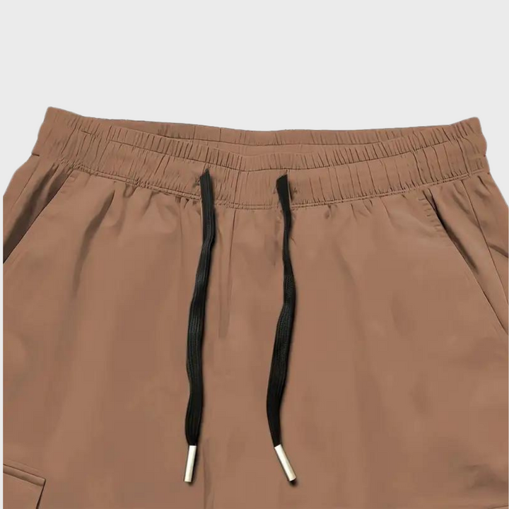 Nael Berlin | Herren Cargo Jogginghose – Lila Streetwear-Hose mit Reißverschlusstaschen & Bündchen